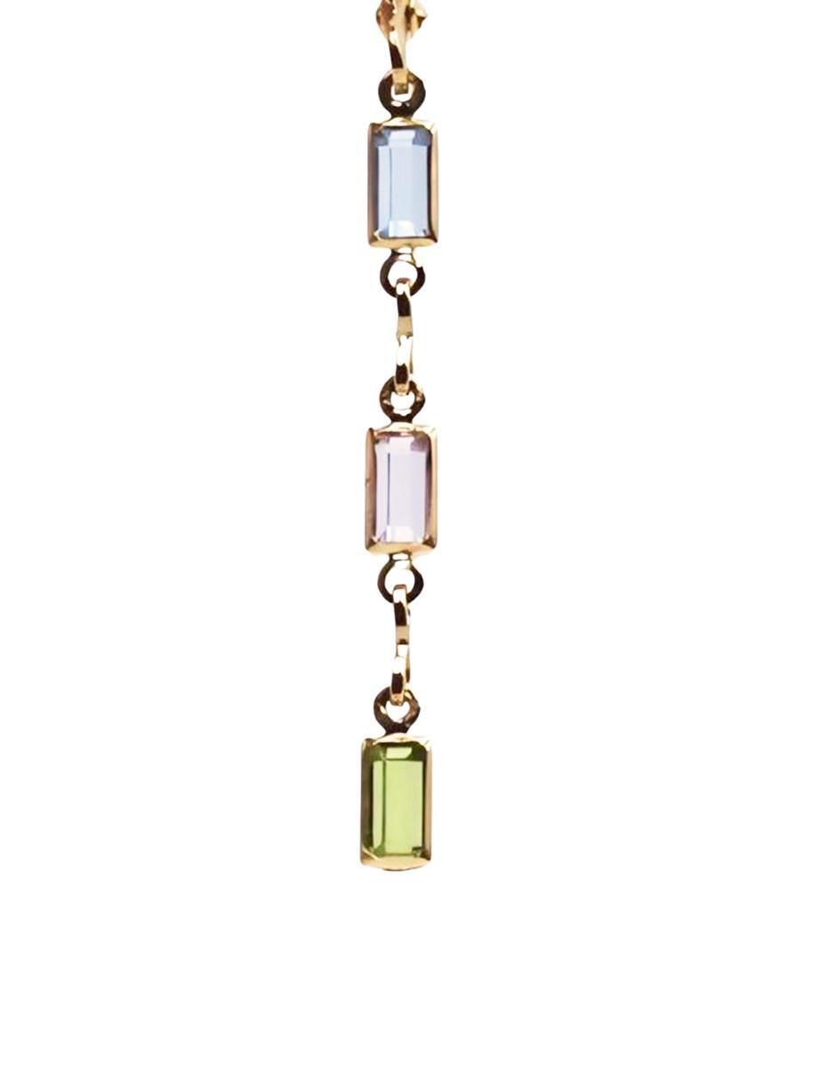 Arete largo rectangular Mada de oro laminado 18k con acabado liso cristal