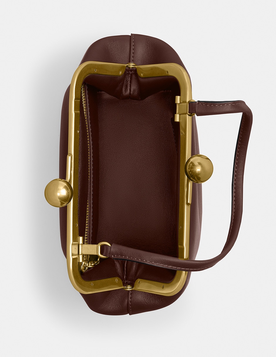 Bolsa clutch Kisslock de piel para mujer